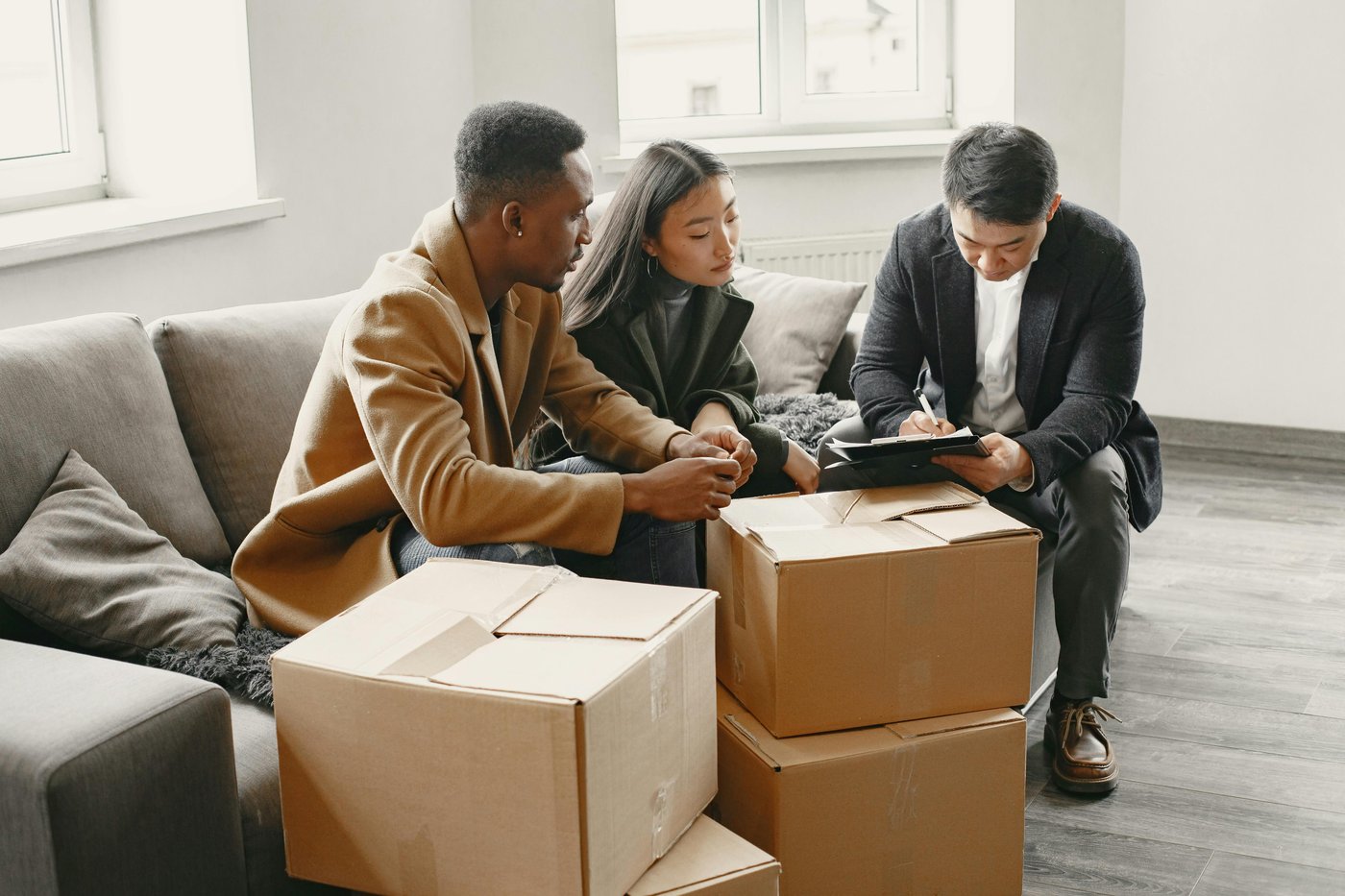 A realtor meeting with a young couple about homeownership